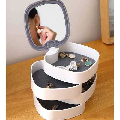 Miroir et boîte à accessoires rotative