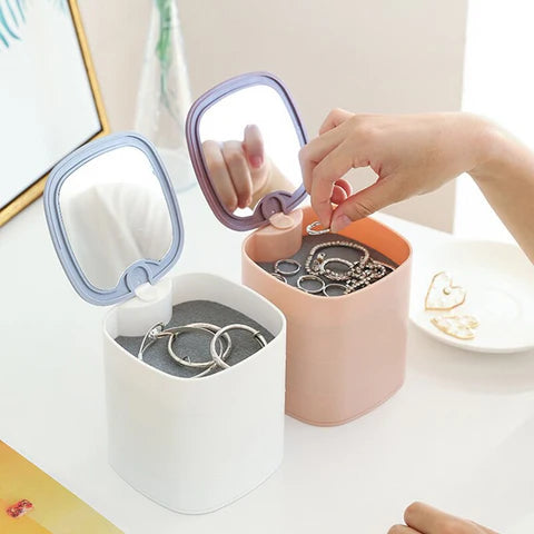 Miroir et boîte à accessoires rotative